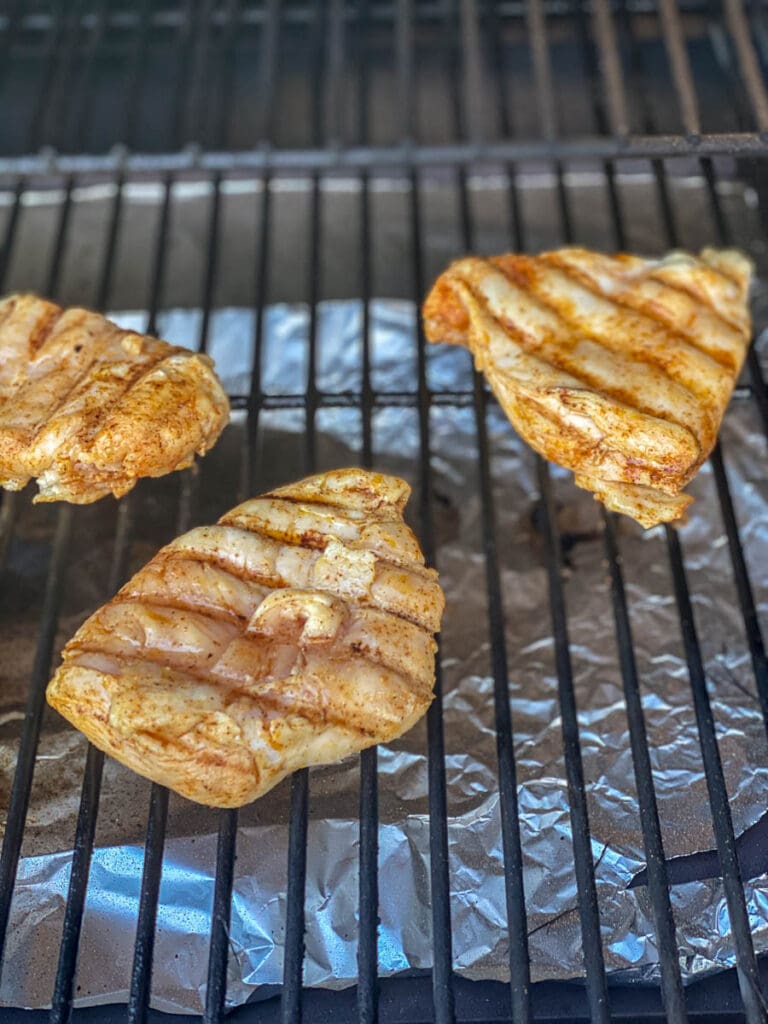 3 pieces of chicken on the grill