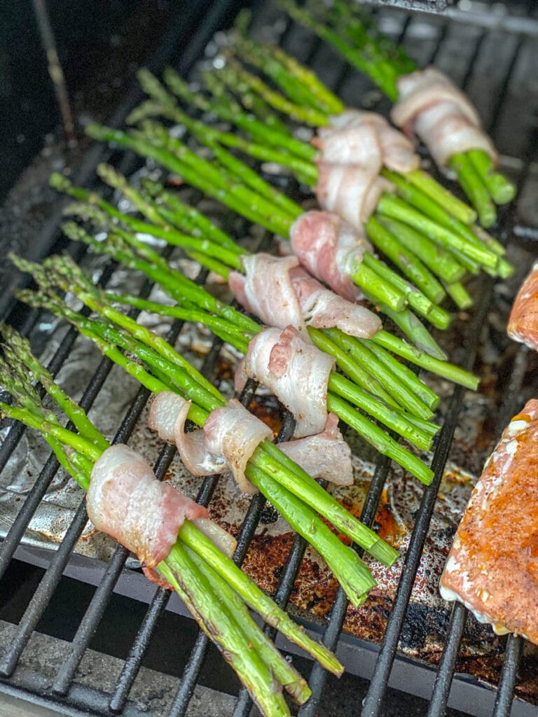 8 bundles of asparagus wrapped bacon on the grill