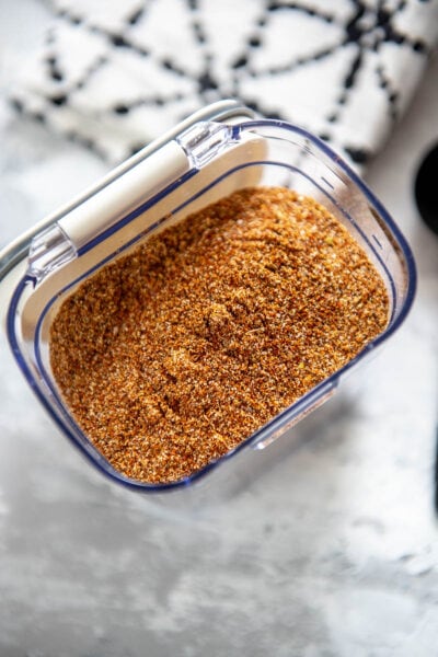 homemade taco seasoning blend in container with lid open