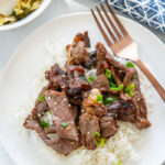 beef bulgogi on white plate with fork