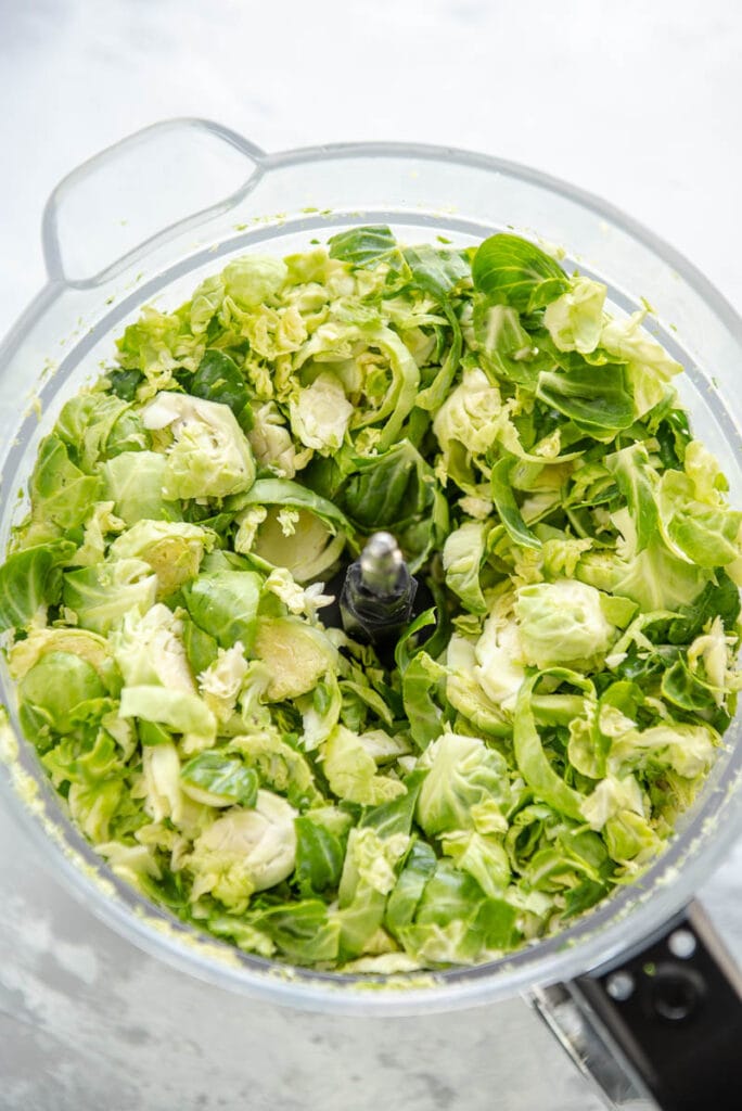 shredded Brussel sprouts in food processor bowl