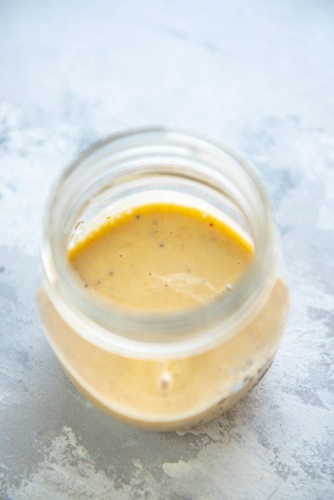 honey mustard dressing in a clear jar
