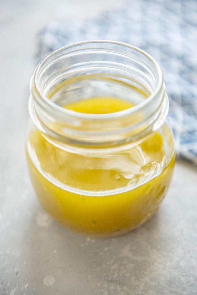 jar with lemon vinaigrette dressing