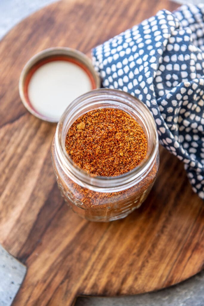 chili seasoning in a glass jar with lid off