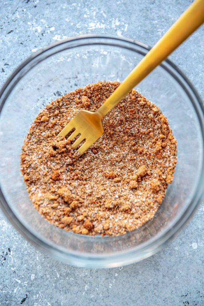 steak seasoning ingredients mixed with a fork in a bowl