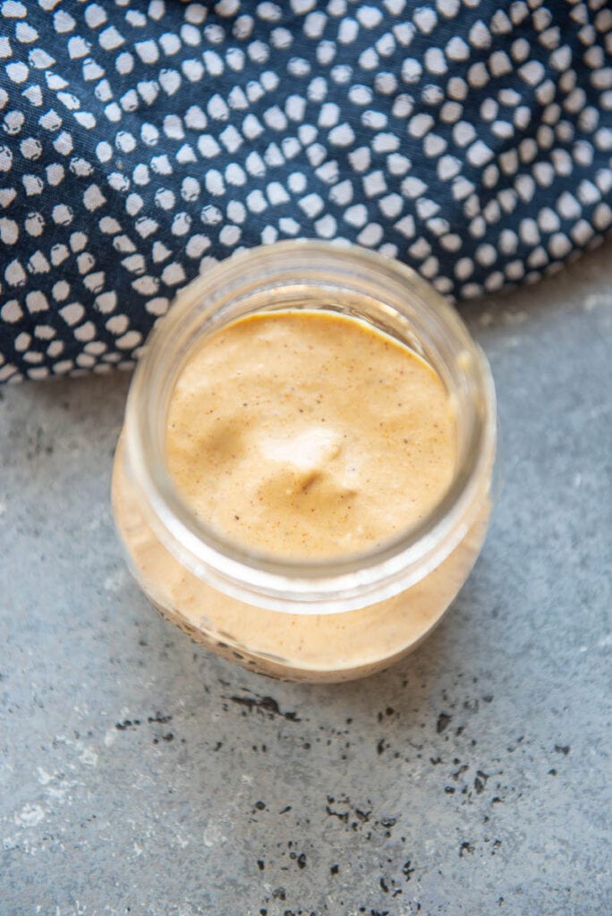 spicy burger sauce in a jar without lid